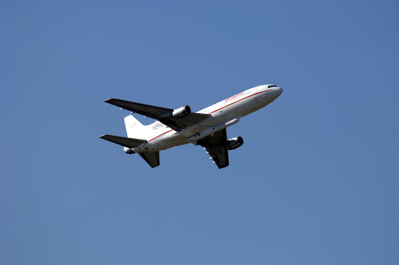 VANDENBERG AIR FORCE BASE, FLA. - The Orbital Sciences L-1011 aircraft soars through the sky to launch the Orbital Sciences Pegasus XL launch vehicle and Demonstration of Autonomous Rendezvous Technology (DART) spacecraft attached to its underbelly. DART was designed and built for NASA by Orbital Sciences as an advanced flight demonstrator to locate and maneuver near an orbiting satellite. The DART spacecraft weighs about 800 pounds and is nearly 6 feet long and 3 feet in diameter. The Pegasus XL vehicle will launch DART into a circular polar orbit of approximately 475 miles. Once in orbit, DART will make contact with a target satellite, the Multiple Paths, Beyond-Line-of-Sight Communications (MUBLCOM), also built by Orbital Sciences and launched in 1999. DART will then perform several close-proximity operations, such as moving toward and away from the satellite using navigation data provided by on-board sensors. The entire mission will last only 24 hours and will be accomplished without human intervention. The DART flight computer will determine its own path to accomplish its mission objectives.