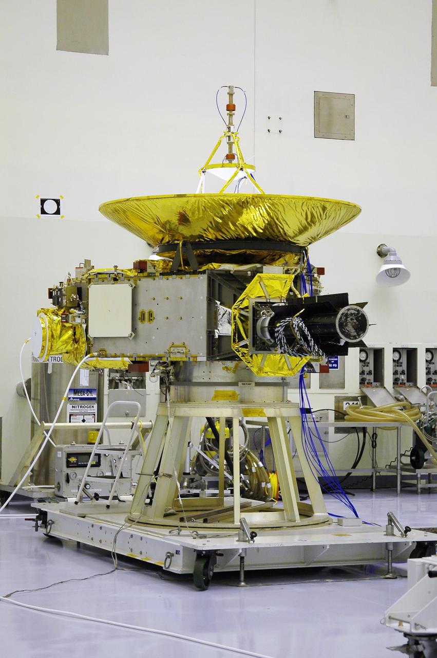KENNEDY SPACE CENTER, FLA. - In NASA Kennedy Space Center’s Payload Hazardous Servicing Facility, the New Horizons spacecraft rests on a work stand. New Horizons will make the first reconnaissance of Pluto and Charon - a 'double planet' and the last planet in our solar system to be visited by spacecraft. The mission will then visit one or more objects in the Kuiper Belt region beyond Neptune. New Horizons is scheduled to launch in January 2006, swing past Jupiter for a gravity boost and scientific studies in February or March 2007, and reach Pluto and its moon, Charon, in July 2015.