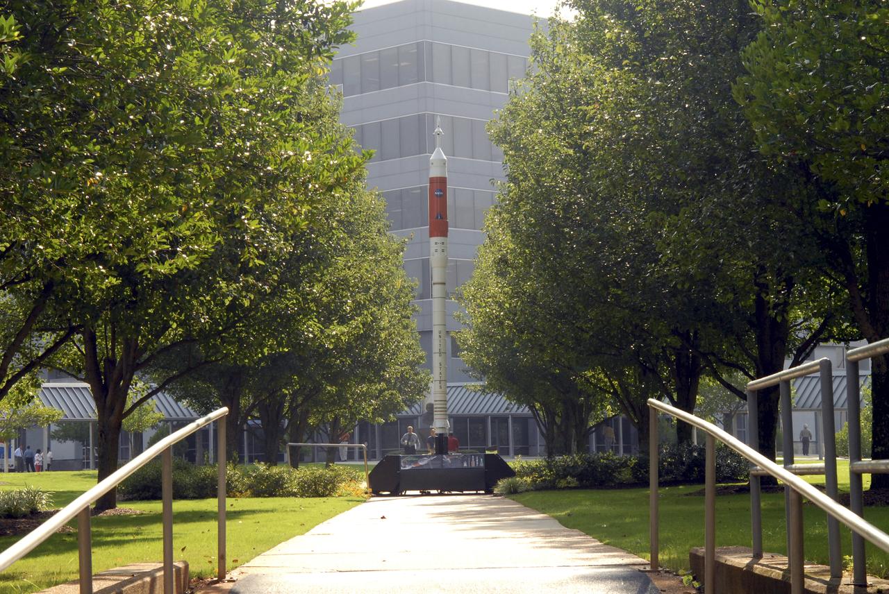 A model of the new Aries I crew launch vehicle, for which NASA is designing, testing and evaluating hardware and related systems, is seen here on display at the Marshall Space Fight Center (MSFC), in Huntsville, Alabama. The Ares I crew launch vehicle is the rocket that will carry a new generation of space explorers into orbit.  Under the goals of the Vision for Space Exploration, Ares I is a chief component of the cost-effective space transportation infrastructure being developed by NASA’s Constellation Program. These transportation systems will safely and reliably carry human explorers back to the moon, and then onward to Mars and other destinations in the solar system. The Ares I effort includes multiple project element teams at NASA centers and contract organizations around the nation, and is led by the Exploration Launch Projects Office at NASA’s MFSC. Together, these teams are developing vehicle hardware, evolving proven technologies, and testing components and systems. Their work builds on powerful, reliable space shuttle propulsion elements and nearly a half-century of NASA space flight experience and technological advances. Ares I is an inline, two-stage rocket configuration topped by the Crew Exploration Vehicle, its service module and a launch abort system. The launch vehicle’s first stage is a single, five-segment reusable solid rocket booster derived from the Space Shuttle Program’s reusable solid rocket motor that burns a specially formulated and shaped solid propellant called polybutadiene acrylonitrile (PBAN). The second or upper stage will be propelled by a J-2X main engine fueled with liquid oxygen and liquid hydrogen. In addition to its primary mission of carrying crews of four to six astronauts to Earth orbit, the launch vehicle’s 25-ton payload capacity might be used for delivering cargo to space, bringing resources and supplies to the International Space Station or dropping payloads off in orbit for retrieval and transport to exploration teams on the moon. Crew transportation to the space station is planned to begin no later than 2014. The first lunar excursion is scheduled for the 2020 timeframe.