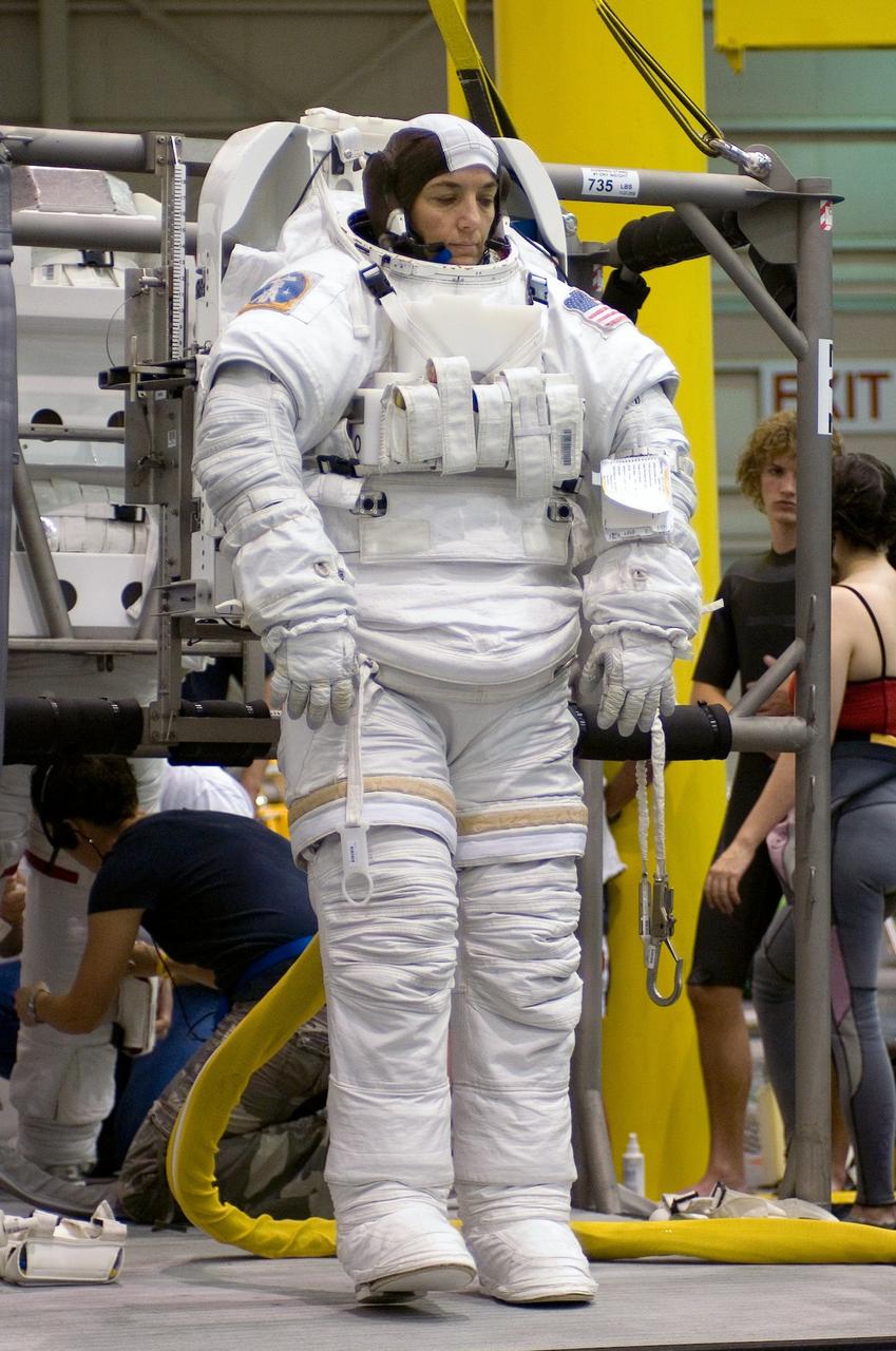 Attired in a training version of the Extravehicular Mobility Unit (EMU) space suit, STS-115 astronaut and mission specialist, Heidemarie M. Stefanyshyn-Piper, is about to begin a training session in the Neutral Buoyancy Laboratory (NBL) near Johnson Space Center in preparation for the STS-115 mission. Launched on September 9, 2006, the STS-115 mission continued assembly of the International Space Station (ISS) with the installation of the truss segments P3 and P4.   