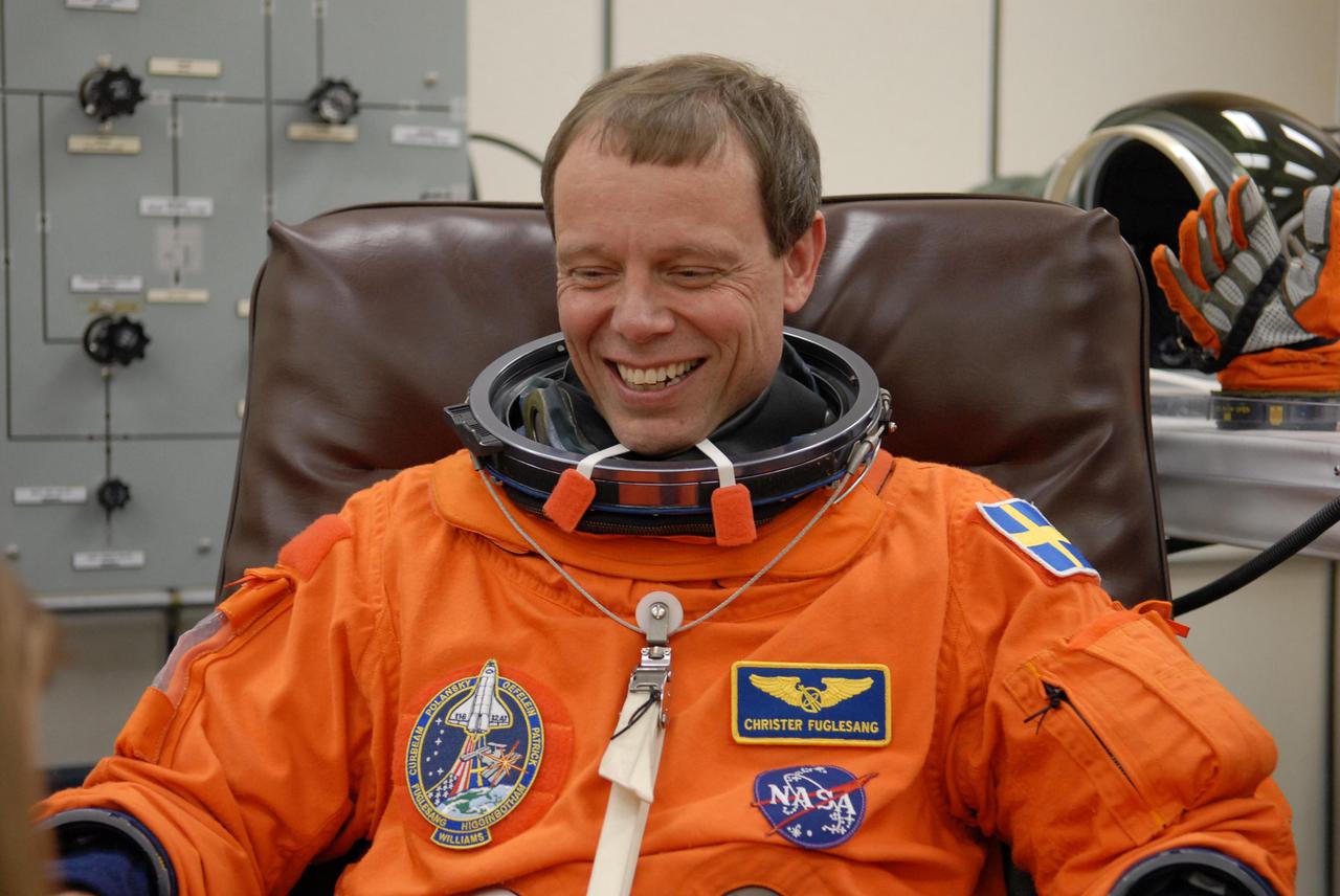 KENNEDY SPACE CENTER, FLA. --  The crew members of mission STS-116 are suiting up for launch at 9:35 p.m. EST from Launch Pad 39B aboard Space Shuttle Discovery.  Pictured here is Mission Specialist Christer Fuglesang, who will be making his first shuttle flight.  This is Discovery's 33rd mission and the first night launch since 2003.   The 20th shuttle mission to the International Space Station, STS-116 carries another truss segment, P5. It will serve as a spacer, mated to the P4 truss that was attached in September.  After installing the P5, the crew will reconfigure and redistribute the power generated by two pairs of U.S. solar arrays. Landing is expected Dec. 19 at KSC.   Photo credit: NASA_Kim Shiflett