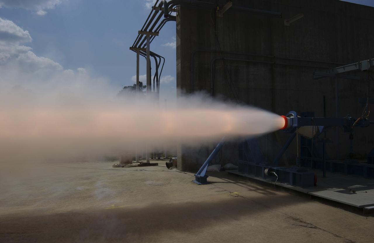 This photograph depicts a hot fire test of the Shuttle Booster Separation Motor (BSM)  at the Marshall Space Flight Center (MSFC) test stand 116. The objective of the  test was to test the aft heat seal in flight configuration. The function of the motor is to separate the Shuttle vehicle from the boosters that carry it into space. 