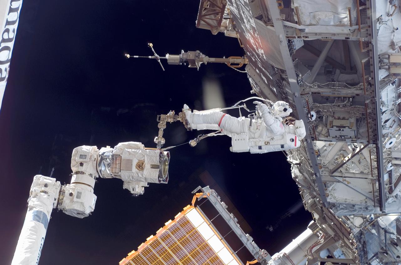 As the construction continued on the International Space Station (ISS), STS-118 astronaut and mission specialist Rick Mastracchio was anchored on the foot restraint of the Canadarm2 as he participated in the third session of Extra Vehicular Activity (EVA) for the mission. Assisting Mastracchio was Expedition 15 flight engineer Clay Anderson (out of frame). During the 5 hour, 28 minute space walk, the two relocated the S-band Antenna Sub-Assembly from the Port 6 (P6) truss to the Port 1 (P1) truss, installed a new transponder on P1 and retrieved the P6 transponder.