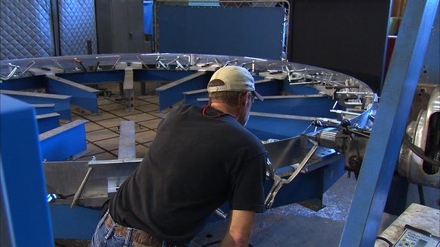 Under the goals of the Vision for Space Exploration, Ares I is a chief component of the cost-effective space transportation infrastructure being developed by NASA's Constellation Program. This transportation system will safely and reliably carry human explorers back to the moon, and then onward to Mars and other destinations in the solar system. The Ares I effort includes multiple project element teams at NASA centers and contract organizations around the nation, and is managed by the Exploration Launch Projects Office at NASA's Marshall Space Flight Center (MFSC). ATK Launch Systems near Brigham City, Utah, is the prime contractor for the first stage booster. ATK's subcontractor, United Space Alliance of Houston, is designing, developing and testing the parachutes at its facilities at NASA's Kennedy Space Center in Florida. NASA's Johnson Space Center in Houston hosts the Constellation Program and Orion Crew Capsule Project Office and provides test instrumentation and support personnel. Together, these teams are developing vehicle hardware, evolving proven technologies, and testing components and systems. Their work builds on powerful, reliable space shuttle propulsion elements and nearly a half-century of NASA space flight experience and technological advances. Ares I is an inline, two-stage rocket configuration topped by the Crew Exploration Vehicle, its service module, and a launch abort system. This HD video image depicts the preparation and placement of a confidence ring for friction stir welding used in manufacturing aluminum panels that will fabricate the Ares I upper stage barrel. The aluminum panels are manufactured and subjected to confidence tests during which the bent aluminum is stressed to breaking point and thoroughly examined. The panels are manufactured by AMRO Manufacturing located in El Monte, California.    (Highest resolution available)