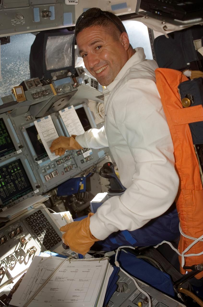 Astronaut George Zamka, STS-120 pilot, is seated at the pilot's station on the forward flight deck of the Space Shuttle Discovery during rendezvous and docking operations with the International Space Station (ISS). The STS-120 mission launched from Kennedy Space Center's launch pad 39A at 11:38:19 a.m. (EDT) on October 23, 2007. The crew also included Scott E. Parazynski, Douglas H. Wheelock, Stephanie D. Wilson, all mission specialists; Pamela A. Melroy, commander; Daniel M. Tani, Expedition 16 flight engineer; and Paolo A. Nespoli, mission specialist representing the European Space Agency (ESA). Major objectives included the installation of the P6 solar array of the port truss and delivery and installment of Harmony, the Italian-built U.S. Node 2 on the ISS.