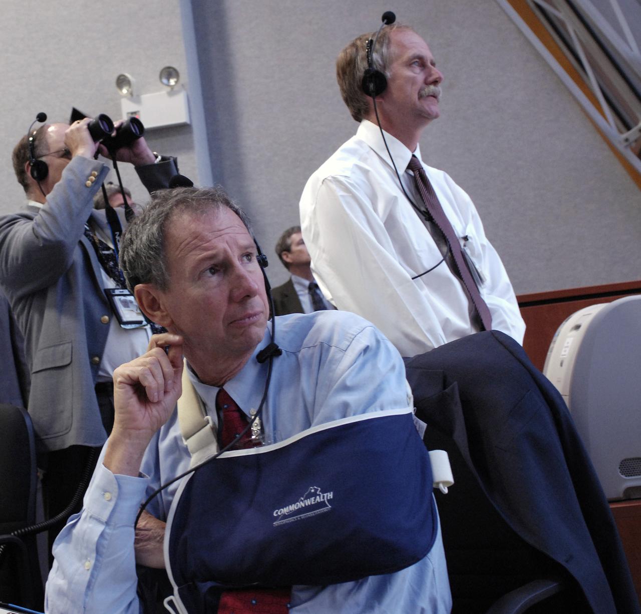 NASA Administrator, Michael Griffin (foreground) watches the launch of the Space Shuttle Endeavour (STS-118) from the Launch Control Center Wednesday, August 8, 2007, at the Kennedy Space Center in Cape Canaveral, Fla. The Shuttle lifted off from launch pad 39A at 6:36p.m. EDT. Photo Credit: "NASA/Bill Ingalls"