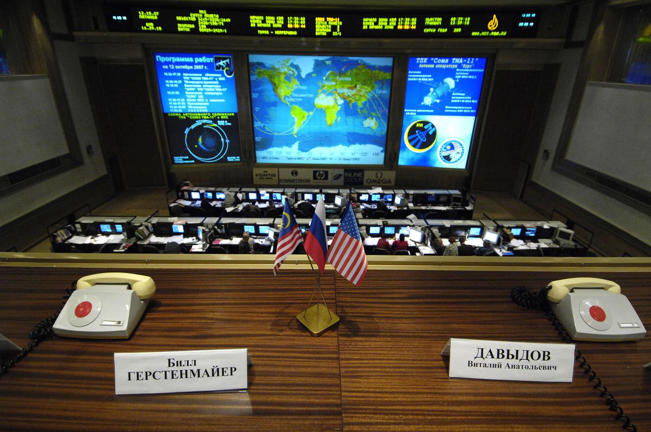 The flags of Malaysia, Russia and the United States sit between the phones used by officials to talk to the crew of the International Space Station (ISS) in the Russian Mission Control Center in Korolev, outside Moscow. Expedition 16 Commander Peggy Whitson, Soyuz Commander and Flight Engineer Yuri Malenchenko and Malaysian Spaceflight Participant Sheikh Muszaphar Shukor docked their Soyuz TMA-11 spacecraft to the station at 10:50 a.m. EDT. Oct. 12, 2007. The crew launched on Wednesday from the Baikonur Cosmodrome in Kazakhstan. Photo Credit: "NASA/Bill Ingalls"
