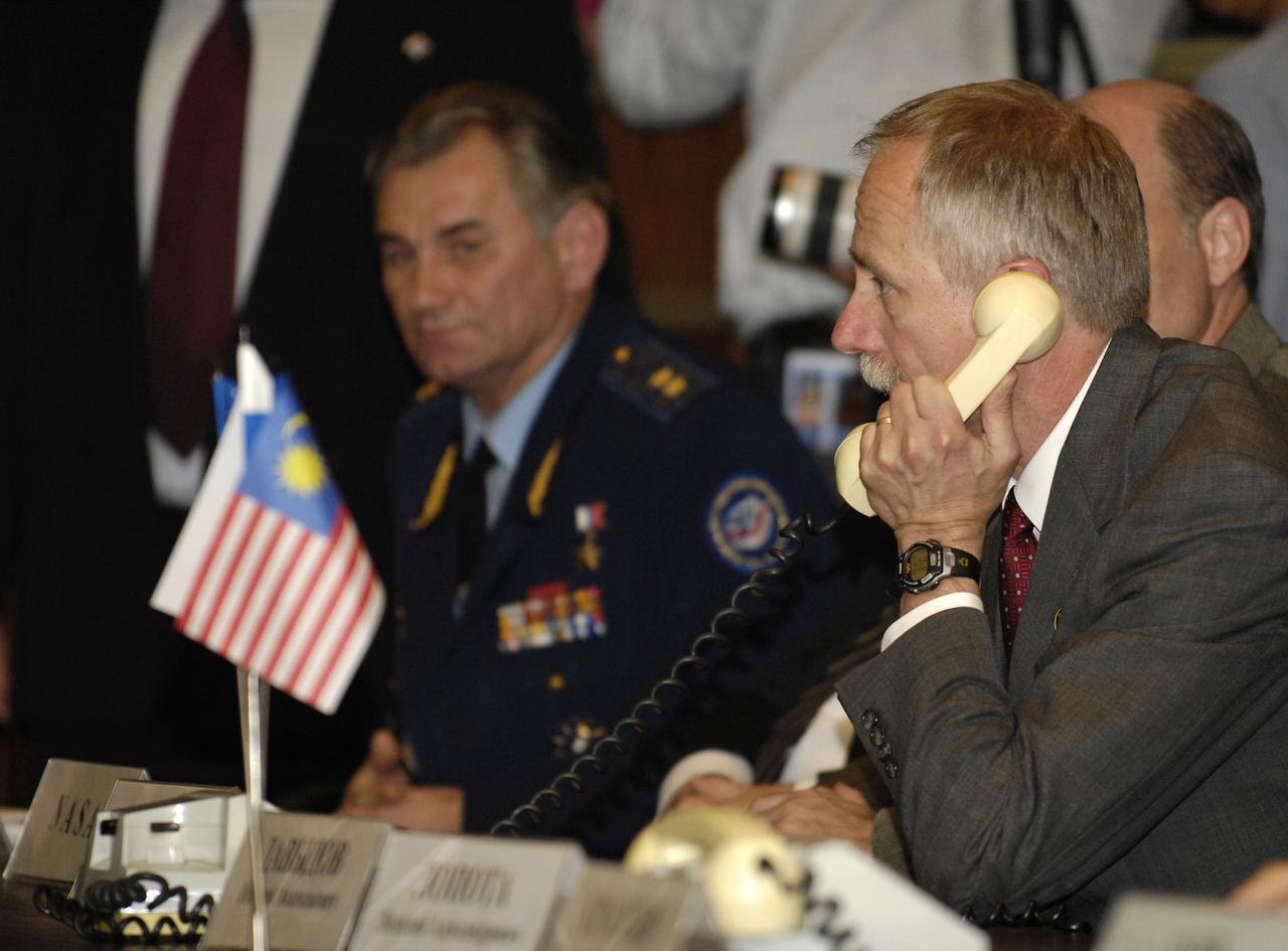 William Gerstenmaier, NASA Associate Administrator for Space Operations speaks on the phone to the crews of the International Space Station, October 12, 2007 from the Russian Mission Control Center in Korolev, outside of Moscow. Expedition 16 Commander Peggy Whitson, Soyuz Commander and Flight Engineer Yuri Malenchenko and Malaysian Spaceflight Participant Sheikh Muszaphar Shukor docked their Soyuz TMA-11 spacecraft to the station at 10:50 a.m. EDT. Oct. 12, 2007. The crew launched on Wednesday from the Baikonur Cosmodrome in Kazakhstan. Photo Credit: "NASA/Bill Ingalls"