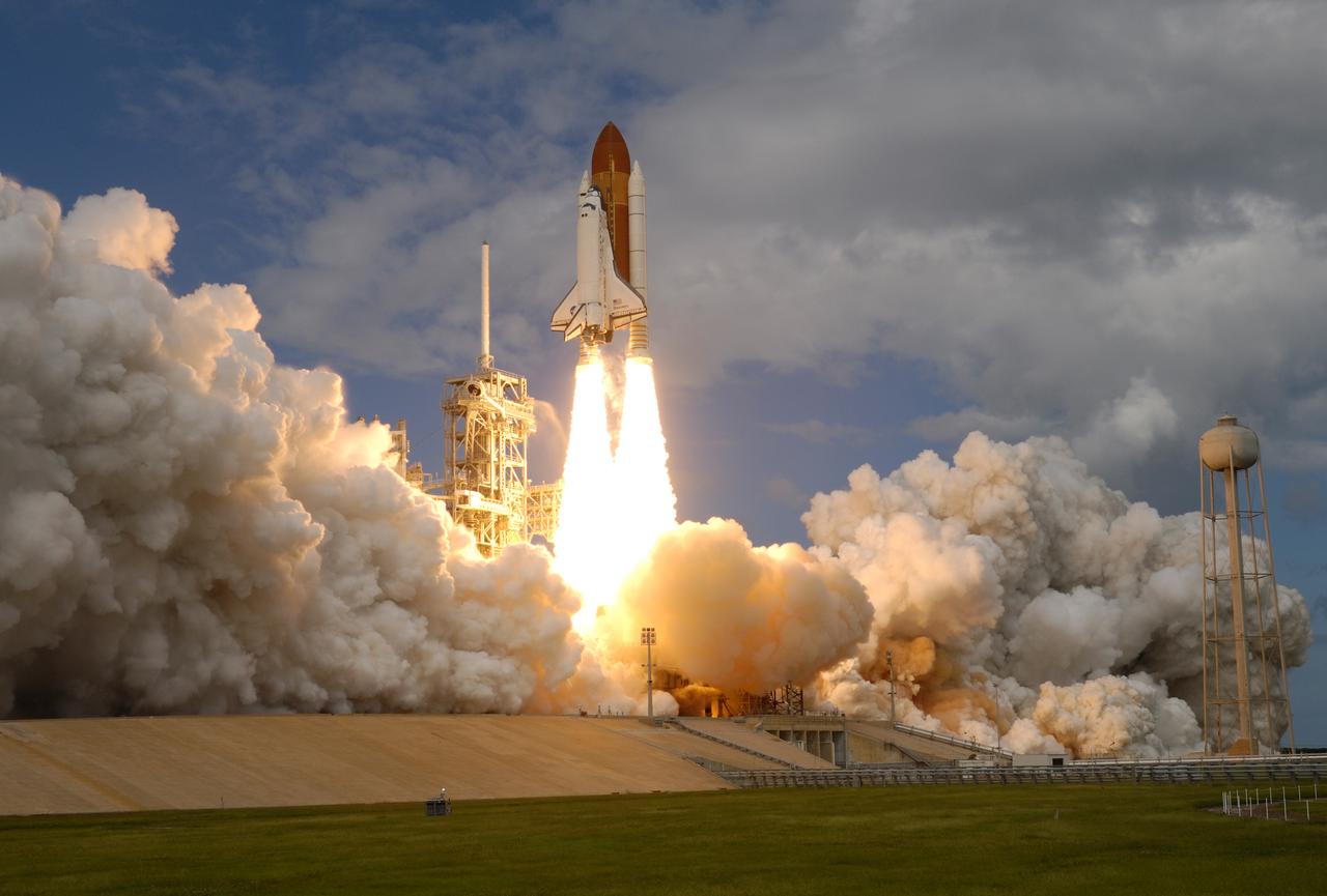 (10/23/2007) --- KENNEDY SPACE CENTER, FLA. -- Out of the clouds of smoke and steam rolling across Launch Pad 39A at NASA's Kennedy Space Center, space shuttle Discovery hurtles toward space on the 23rd assembly mission to the International Space Station. Liftoff was on time at 11:38:19 a.m. EDT. Discovery carries the Italian-built U.S. Node 2, called Harmony. During the 14-day STS-120 mission, the crew will install Harmony and move the P6 solar arrays to their permanent position and deploy them. Discovery is expected to complete its mission and return home at 4:47 a.m. EST on Nov. 6