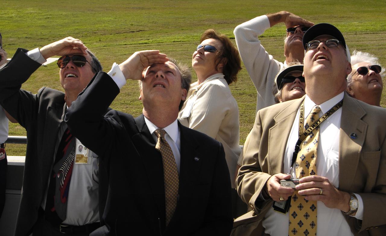 (left to right) NASA Administrator Michael Griffin, NASA Assistant Administrator for Public Affairs David Mould and NASA Space Shuttle Manager Wayne Hale watch as the space shuttle Discovery comes in for landing at NASA's Kennedy Space Center, Fla., completing the 15-day STS-120 mission to the International Space Station. Discovery landed at 1:01pm EST Wednesday after a mission that included on-orbit construction of the station with the installation of the Harmony Node 2 module and the relocation of the P6 truss. Photo Credit: 'NASA/Bill Ingalls"