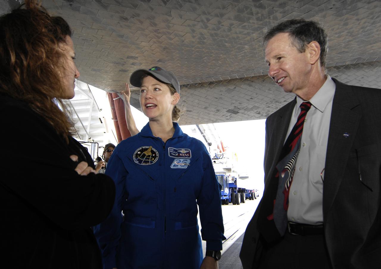 Space shuttle Discovery Commander Pam Melroy talks with NASA Administrator Michael Griffin and his wife, Rebecca Griffin, shortly after Melroy and the crew of STS-120 landed at NASA's Kennedy Space Center in Florida. Discovery landed at 1:02pm EST Wednesday after a mission that included on-orbit construction of the station with the installation of the Harmony Node 2 module and the relocation of the P6 truss. Photo Credit: 'NASA/Bill Ingalls"