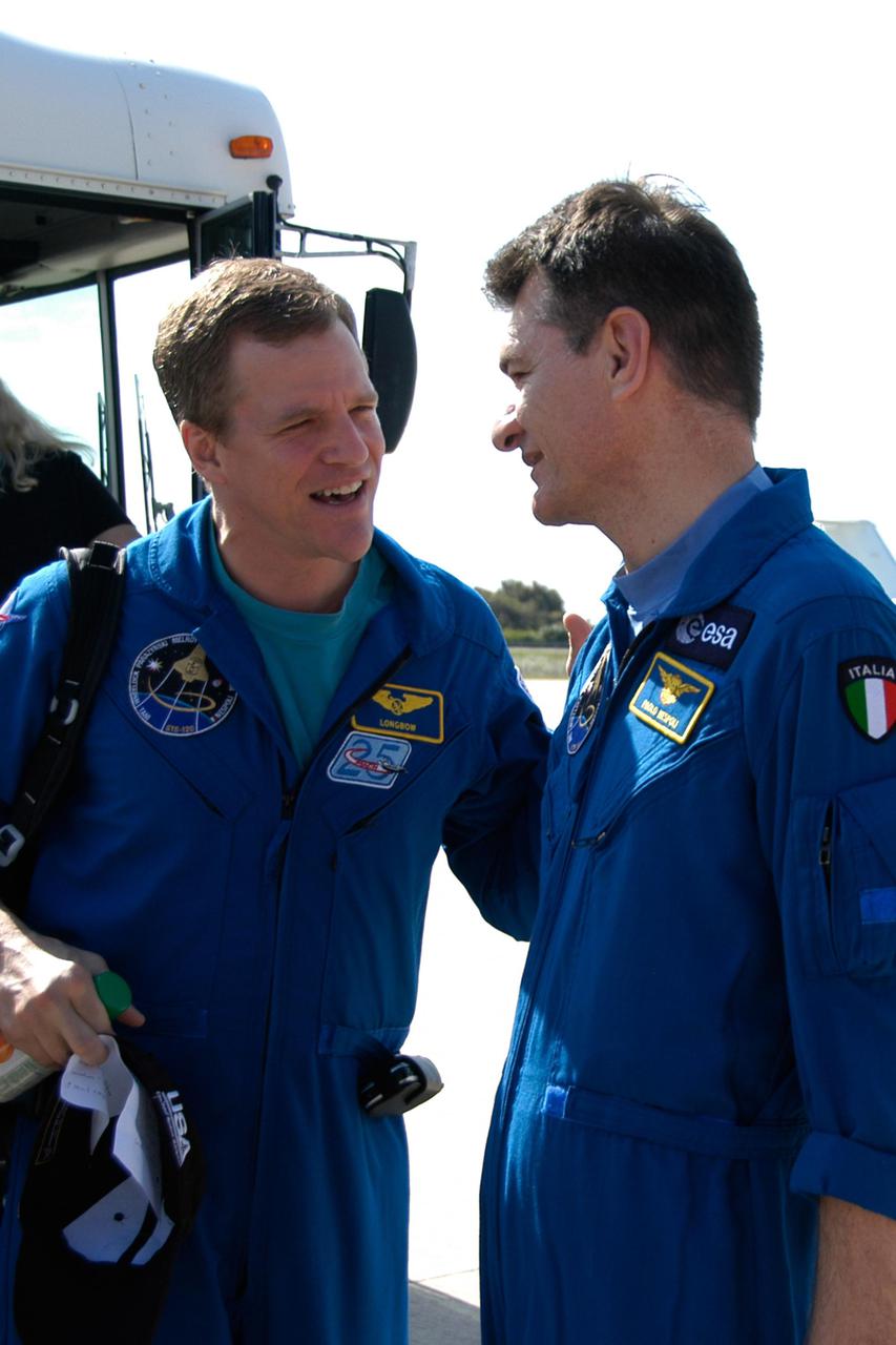 KENNEDY SPACE CENTER, FLA. --  STS-120 Mission Specialists Scott Parazynski (left) and Paolo Nespoli talk before their return to flight to Houston.  A welcoming ceremony for the crew is planned at NASA's Hangar 276 on the south end of Ellington Field in Texas. On the 15-day mission, the STS-120 crew continued the construction of the station with the installation of the Harmony Node 2 module and the relocation of the P6 truss.  They landed Nov. 7 at NASA's Kennedy Space Center . Photo credit: NASA_George Shelton