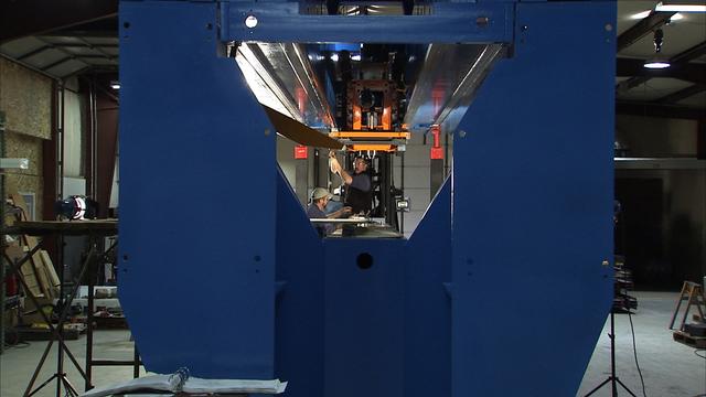 Workers are shown assembling the vertical weld tool in support of the Ares/Constellation upperstage project.  This image extracted from high definition video and is the highest resolution available.