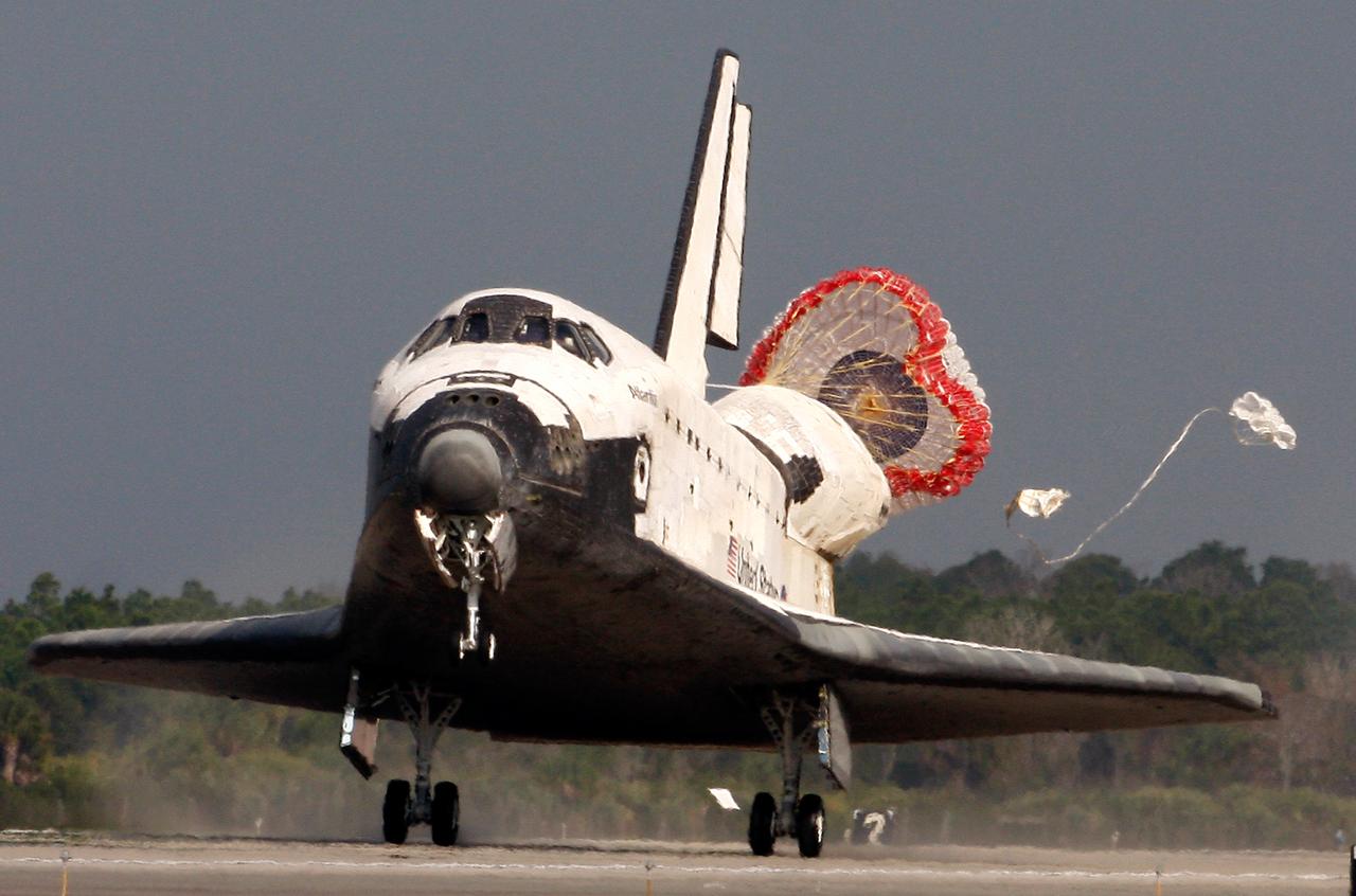 Space shuttle Atlantis lands at the Kennedy Space Center, Shuttle Landing Facility, Cape Canaveral, Florida, USA, 20 February 2008. Atlantis completed a thirteen day mission to the International Space Station where it delivered the latest modu;e to the ISS named Columbus. The parachute deployed out of the rear of Atlantis will help slow don the shuttle after landing.