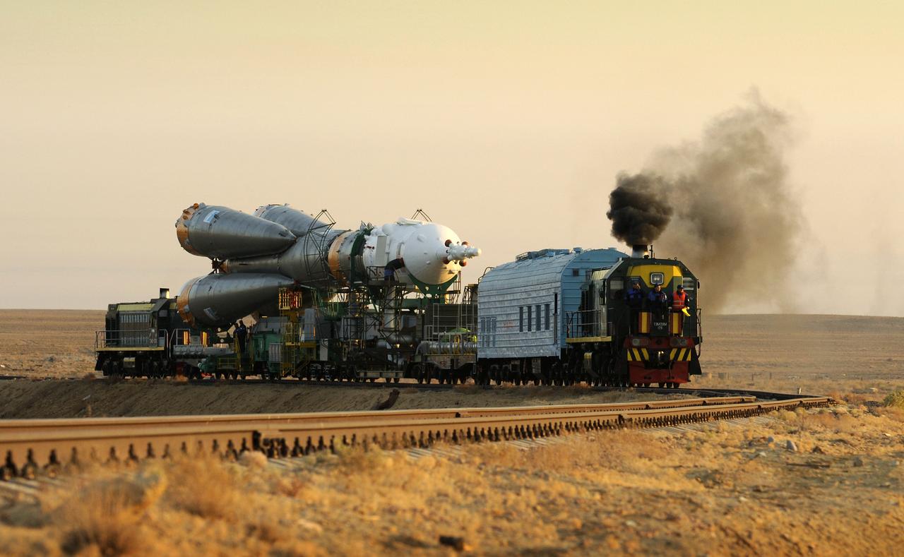 The Soyuz TMA-13 spacecraft is transported by railcar to its launch pad at the Baikonur Cosmodrome in Kazakhstan, Friday, Oct. 10, 2008 for launch Oct. 12 to carry Expedition 18 Commander Michael Fincke, Flight Engineer Yury V. Lonchakov and American Spaceflight Participant Richard Garriott to the International Space Station. The three crew members will dock their Soyuz to the International Space Station on Oct. 14. Fincke and Lonchakov will spend six months on the station, while Garriott will return to Earth Oct. 24, 2008 with two of the Expedition 17 crewmembers currently on the International Space Station.  Photo Credit: (NASA/Bill Ingalls)