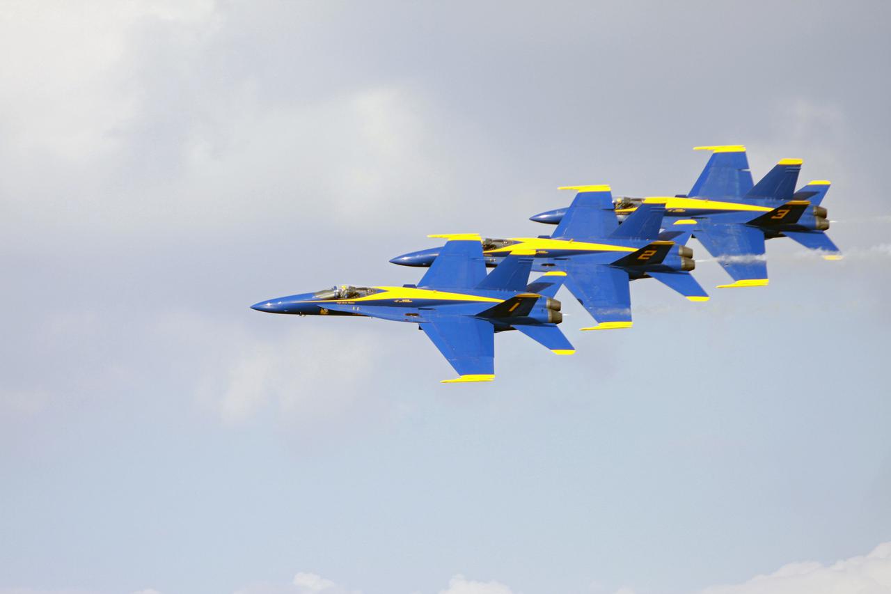 CAPE CANAVERAL, Fla. –  The U.S. Navy's Blue Angels perform their tight maneuvers over NASA's Kennedy Space Center in Florida during the Kennedy Space Center Visitor Complex Space and Air Show held Nov. 8-9. This year’s show brought together the best in military aircraft, such as the F_A-18 Super Hornet and F-16 Fighting Falcon, coupled with precision pilots and veteran astronauts to celebrate spaceflight and aviation. The event included a water rescue demonstration by the 920th Rescue Wing.  Photo credit: NASA_Troy Cryder