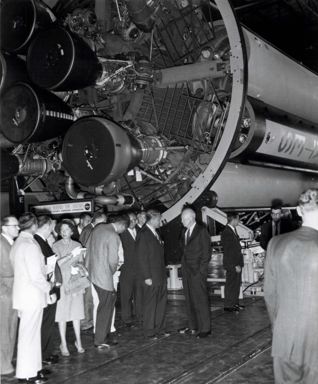 On September 8, 1960 President Dwight D. Eisenhower visited Huntsville, Alabama to dedicate a new NASA field center in honor of General George C. Marshall, Eisenhower's wartime colleague and the founder of the famous Marshall Plan for European recover after World War II. The new George C. Marshall Space Flight Center was placed under the control of Dr. Wernher Von Braun shown here talking with President Eisenhower. As parto f his remarks dedicating the center, President Eisenhowe refereed to General Marshall as a "man of yar, yet a builder of peace". the Marshall Center's first major assignment including building the huge Saturn V rocket that launched human beings on their first journey to the surface of the moon in 1969.