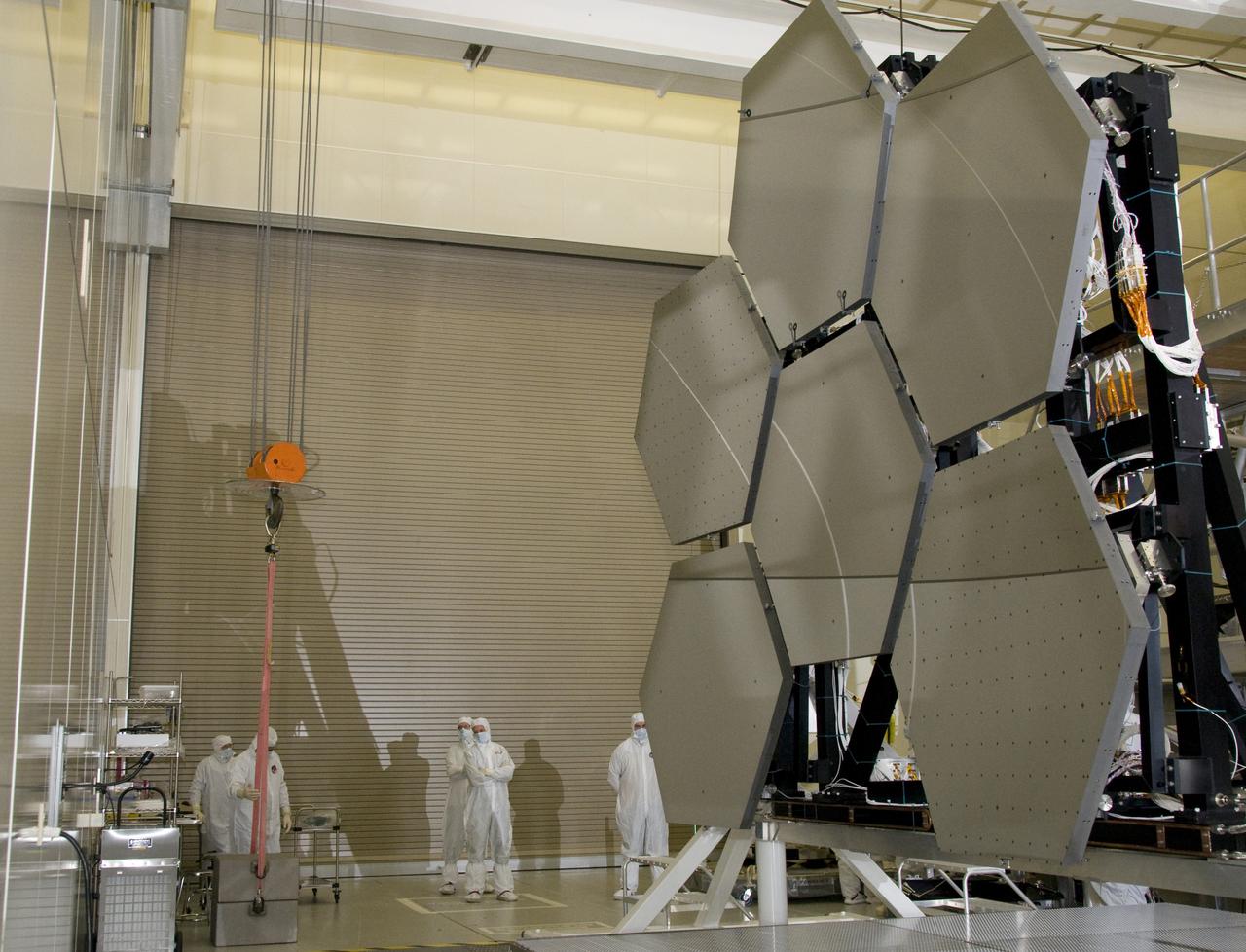 SIX OF THE EIGHTEEN JAMES WEBB SPACE TELESCOPE MIRROR SEGMENTS ARE BEING PREPPED TO MOVE INTO THE X-RAY AND CRYOGENIC FACILITY FOR TESTING.