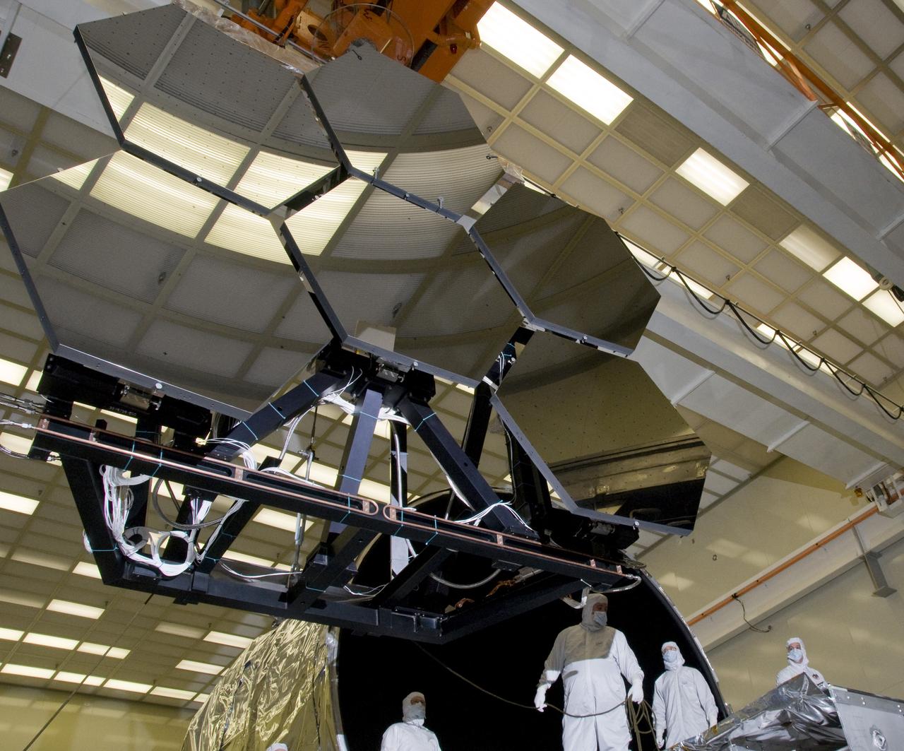 SIX OF THE EIGHTEEN JAMES WEBB SPACE TELESCOPE MIRROR SEGMENTS ARE BEING PREPPED TO MOVE INTO THE X-RAY AND CRYOGENIC FACILITY FOR TESTING.