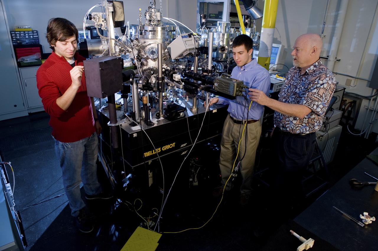 PAUL CHOUFANI, MATTHEW SHERMAN, AND PROFESSOR DOUGLAS MATSON WITH THE ELECTROSTATIC LEVITATOR.