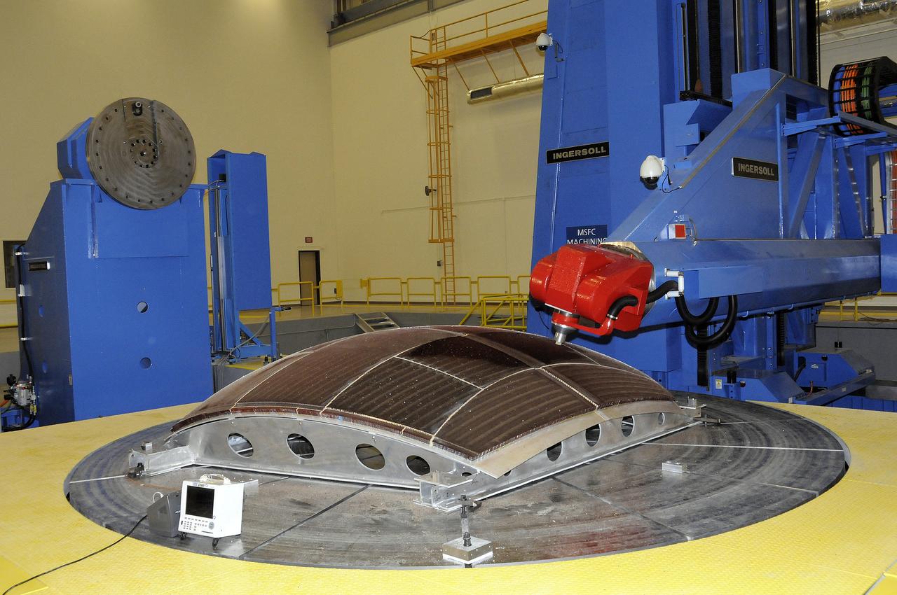 7-AXIS MILLING MACHINE PERFORMING THE ROUGH CUT ON THE 2ND QUARTER DOME DEMONSTRATION ARTICLE HONEYCOMB CORE