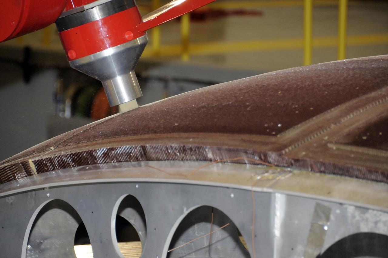 7-AXIS MILLING MACHINE PERFORMING THE ROUGH CUT ON THE 2ND QUARTER DOME DEMONSTRATION ARTICLE HONEYCOMB CORE
