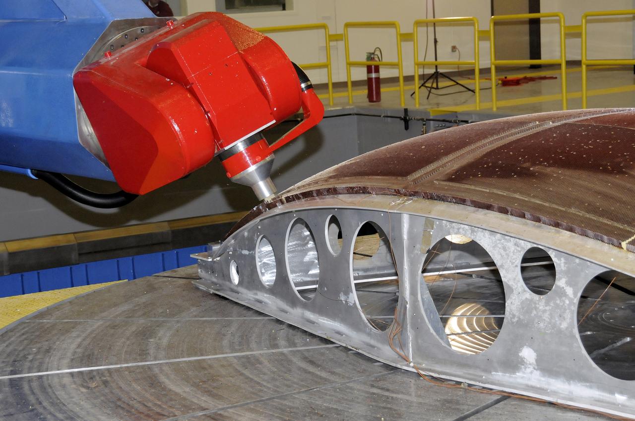 7-AXIS MILLING MACHINE PERFORMING THE ROUGH CUT ON THE 2ND QUARTER DOME DEMONSTRATION ARTICLE HONEYCOMB CORE