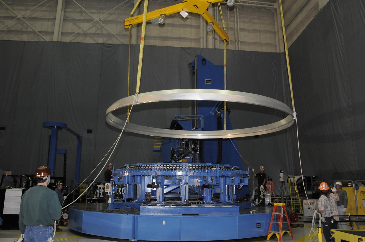 ARES HARDWARE MOVE IN BUILDING 4755 OF A Y-RING INTO THE ROBOTIC WELD TOOL & THE COMMON BULKHEAD DOME MANUFACTURING DEMONSTRATION ARTICLE ONTO THE WOODEN TOOLING STANDS ON FEBRUARY 19, 2010