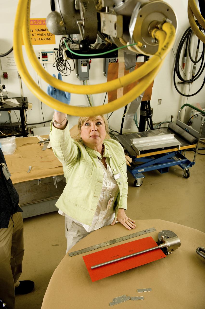 RHONDA LASH, A MATERIALS ENGINEER, PREPARES A SAMPLE CARTRIDGE FOR X-RAY. THE CARTRIDGE WAS TESTED ON THE MATERIAL SCIENCE RESEARCH RACK