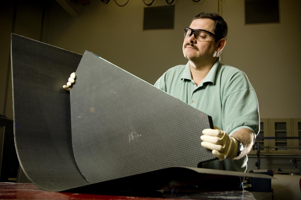 PHILLIP THOMPSON (ENGINEERING TECHNICIAN, ATK LS) ASSEMBLES A COMPOSITE