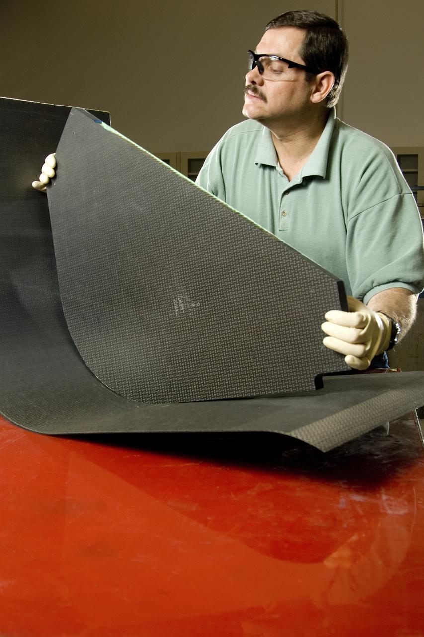 PHILLIP THOMPSON (ENGINEERING TECHNICIAN, ATK LS) ASSEMBLES A COMPOSITE
