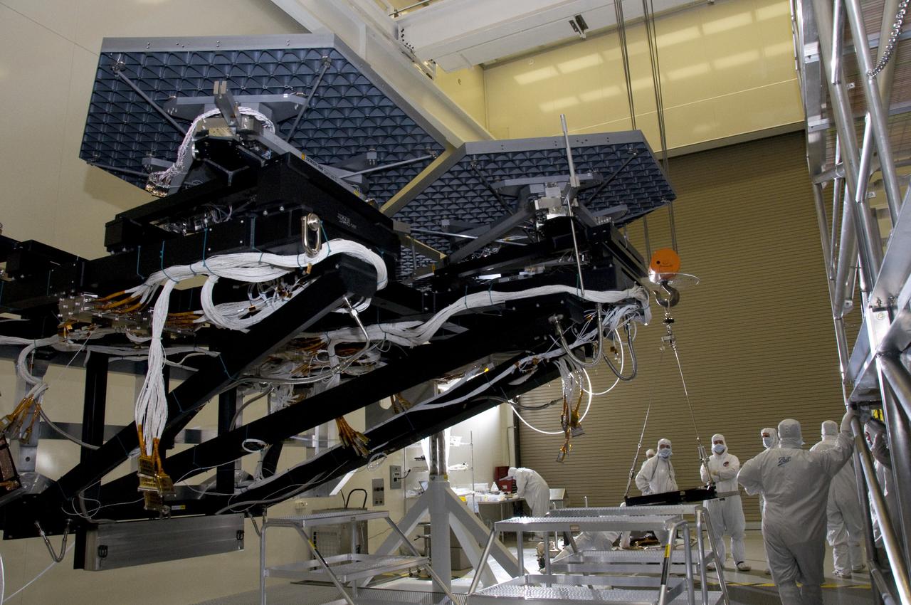 BALL AEROSPACE AND NASA ENGINEERS & TECHNICIANS INSTALL MIRRORS ON THE ROTATABLE CRYOGENIC OPTICAL TEST STAND IN MARSHALL SPACE FLIGHT CENTER’S XRCF CLEAN ROOM 