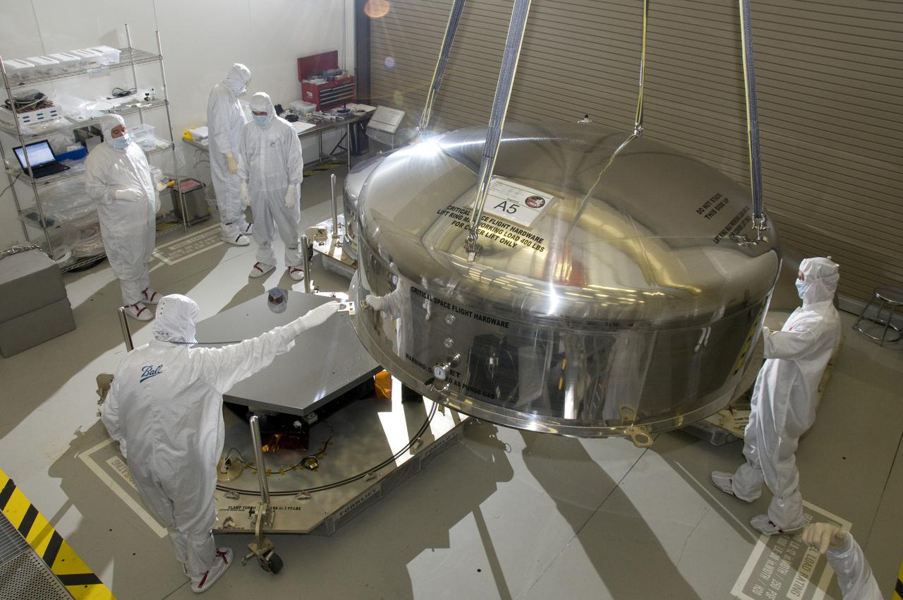 SHIPPING CONTAINER LID BEING REMOVED TO REVEAL A SINGLE JWST PRIMARY MIRROR SEGMENT ASSEMBLY 