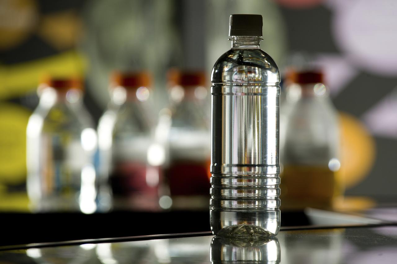 PHOTOS OF BOTTLES CONTAINING URINE, PURIFIED WATER, AND OTHER LIQUIDS AS PART OF THE STEPS OF THE ECLSS PROGRAM