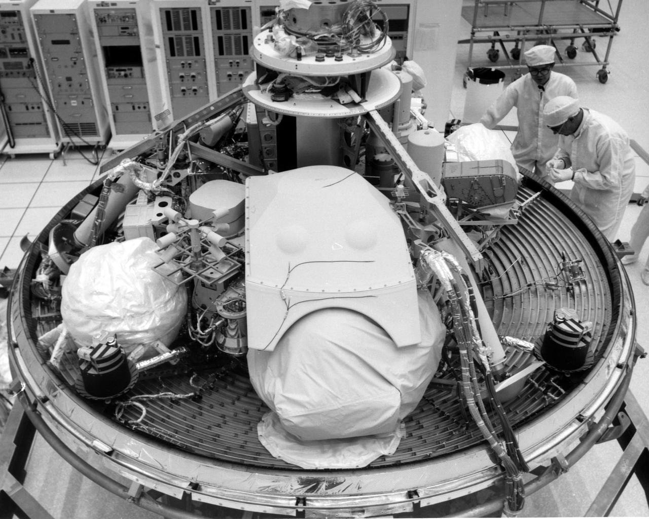 CAPE CANAVERAL, Fla. -- At the Kennedy Space Center in Florida, technicians inspect the Viking Lander 2 in Kennedy's Spacecraft Assembly and Encapsulation Facility 1. The first Viking is scheduled for launch from Launch Complex 41 no earlier than Aug. 11, 1975, the second, no earlier than Aug. 21, 1975. Once in orbit around Mars, the lander will detach and descend to the planet's surface to conduct further investigation. The Viking's 440-million-mile journey to the Red Planet will take about 11 months. Photo Credit: NASA