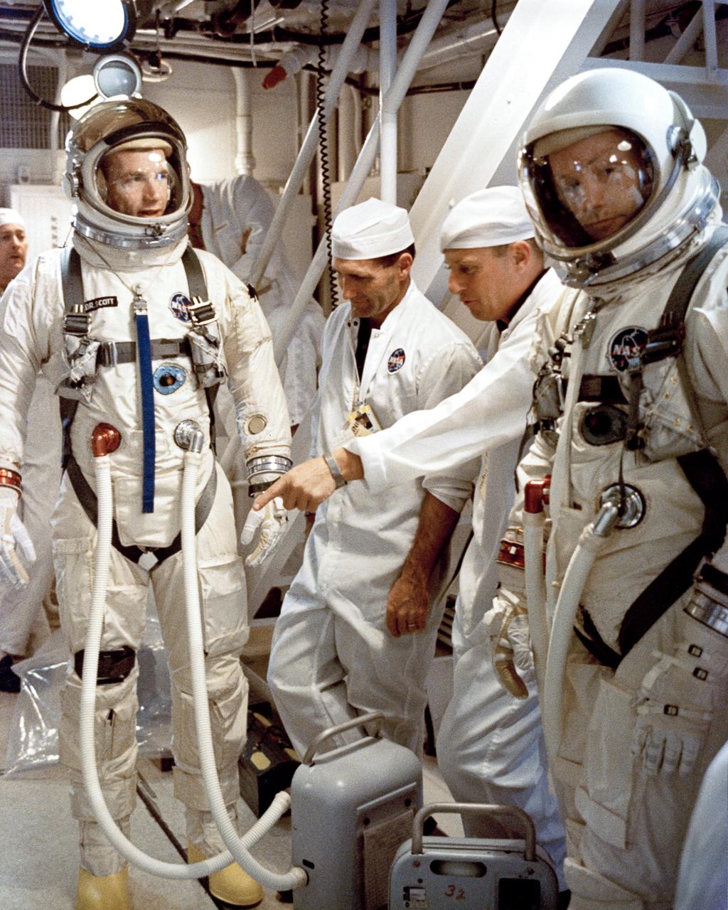 KSC-66C-1836 Gemini-8 Astronauts Neil A. Armstrong, Command Pilot, and David R. Scott, Pilot arrive at White Room, Complex 19 to enter Spacecraft for Simulation Test. (jrs) 