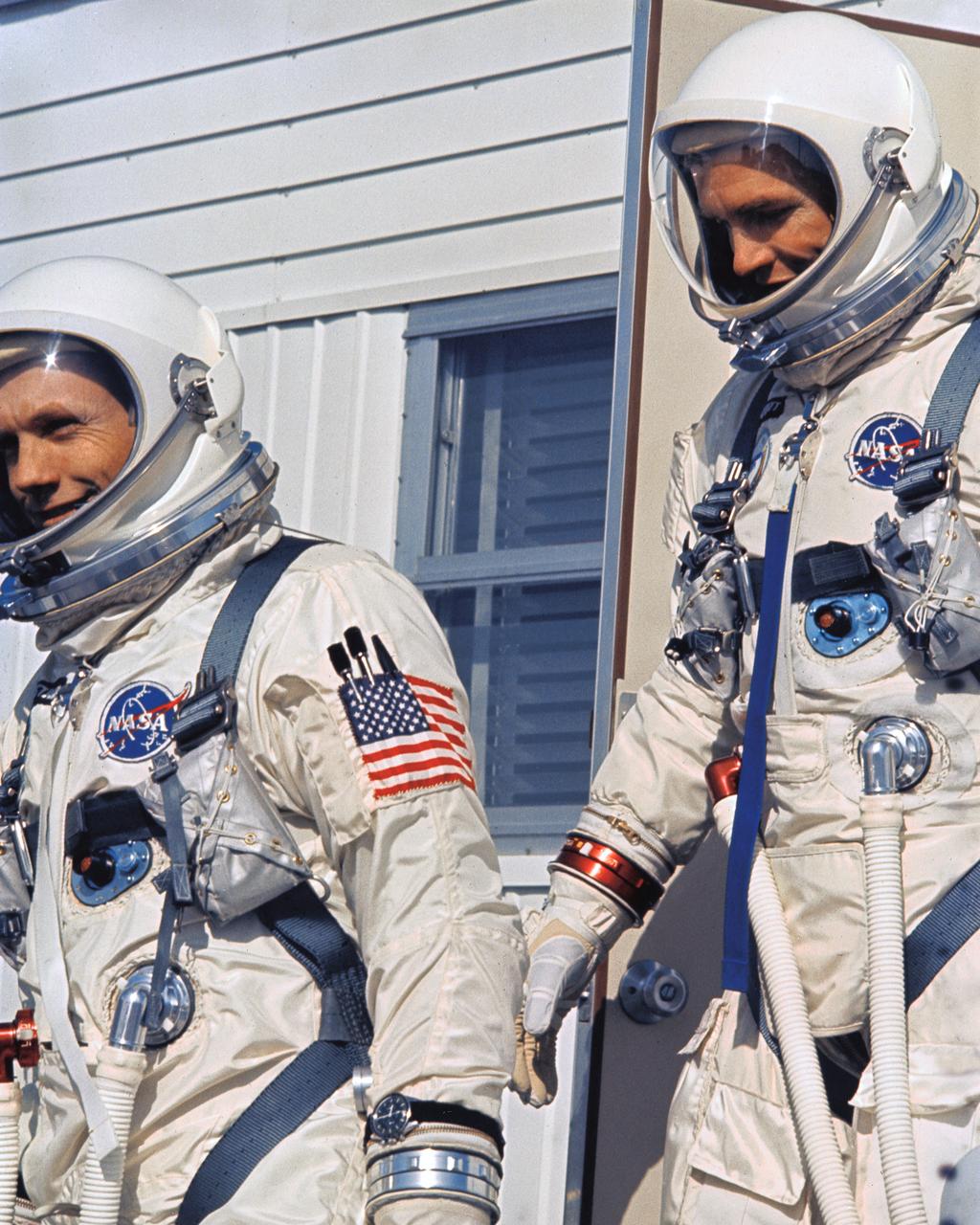 KSC-66C-1851 Astronauts Neil Armstrong and David Scott leave Suiting Trailer to enter Transfer Van, Complex 19, Cape Kennedy prior to boarding their Spacecraft for Gemini 8 Mission. (jrs)