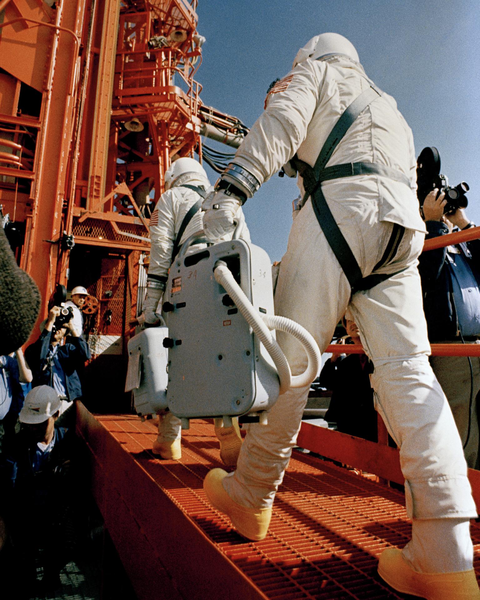 The Gemini 8 astronauts walk up to the elevator to board their spacecraft