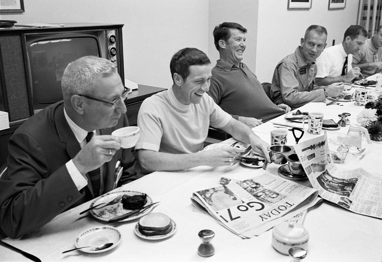CAPE CANAVERAL, Fla. -- Two of the three Apollo 7 astronauts breakfast with National Aeronautics and Space Administration officials at KSC prior to their Earth orbital mission with astronaut Walter Cunningham, not shown. Photo credit: NASA