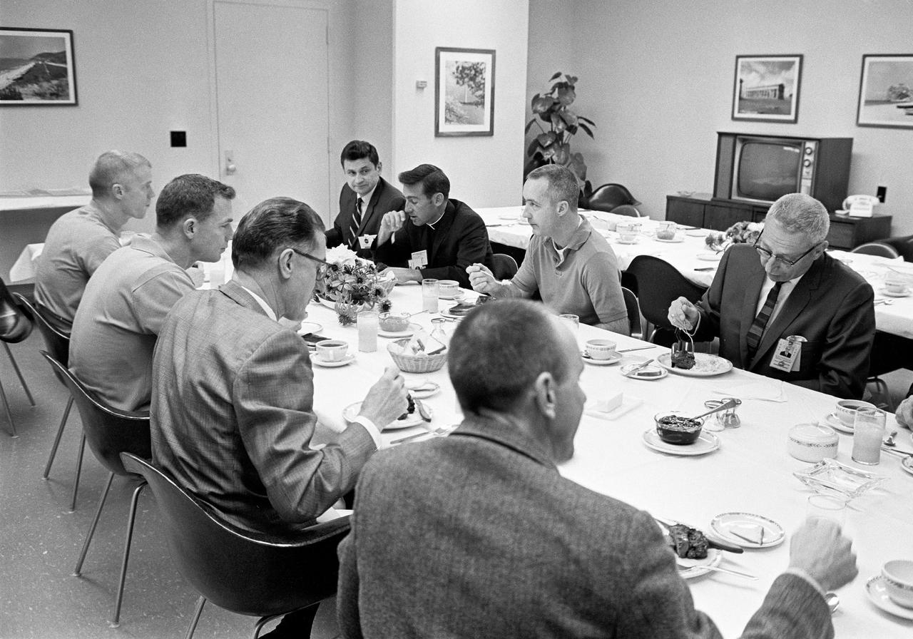 CAPE CANAVERAL, Fla. -- Apollo 9 astronauts James A. McDivitt, David R. Scott, and Russell L. Schweickart breakfast today with mission officials in their crew quarters at the Kennedy Space Center a few hours prior to their scheduled launch into Earth orbit.  Seated in the foreground, left to right, are astronauts Schweickart and Scott Brig. Gen. C. H. Bolendar, manager, Lunar Module and backup Lunar Module Pilot Alan L. Bean. Across the table, left to right, George Skurla, Grumman Aircraft Base Manager at the Spaceport McDivitt's clergyman from his home church at Nassau Bay, Texas, The Rev. Laurence Connelly McDivitt and Kenneth Kleinknecht, manager, Command and Service Modules at the Manned Spacecraft Center. Grumman builds the two-man lunar module spacecraft that will be tested during the planned 10-day space mission.  Photo credit: NASA