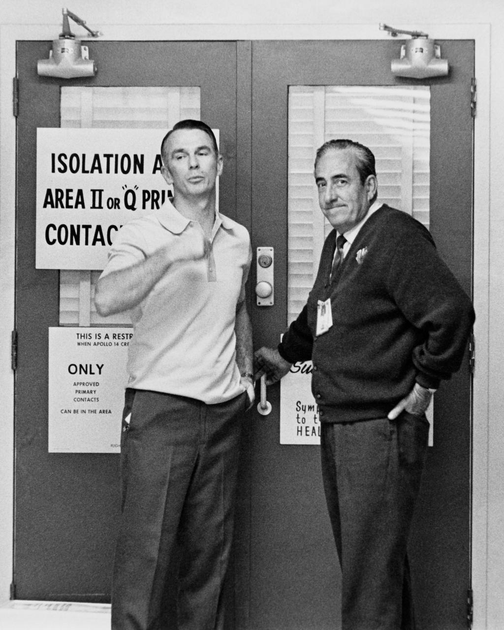 CAPE CANAVERAL, Fla. – Astronaut Gene Cernan, left, stands outside the Astronaut Crew Quarters on Jan. 26, 1971.  Photo credit: NASA