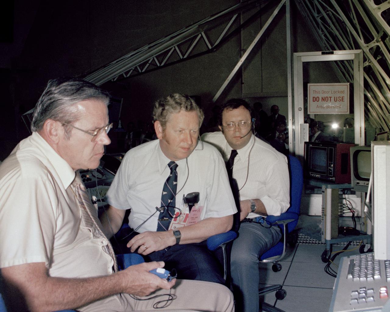 CAPE CANAVERAL, Fla. -- At the Kennedy Space Center in Florida, senior NASA managers monitor Columbia’s progress from their stations in Firing Room 1 following today’s liftoff of the space shuttle on its third journey into space. From left to right are George Page, shuttle launch director, Kenned director Richard Smith and Tom Utsman, Kennedy’s director of technical support. Photo Credit: NASA