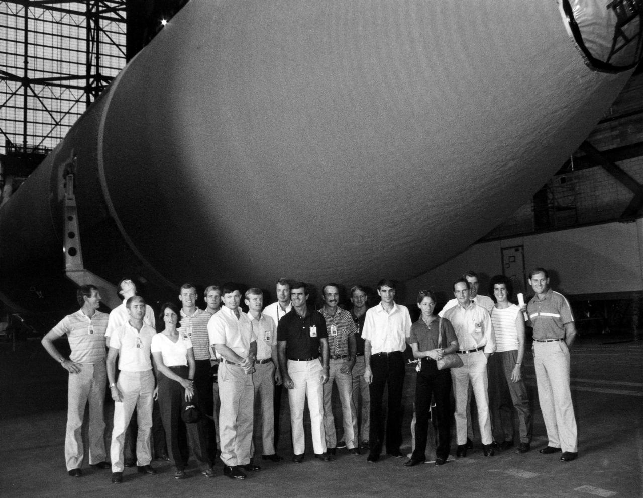 KENNEDY SPACE CENTER, FLA. --  Seventeen new astronaut candidates visited the Vehicle Assembly Building as part of an orientation tour of KSC facilities.  Here they are grouped around one of the external fuel tanks in the transfer aisle of the VAB.  This latest group of candidates is the tenth chosen since the original seven Mercury astronauts.  [From left, Michael J. McCulley, Curtis L. Brown Jr., Frank L. Culbertson Jr., Kathryn C. Thornton, Mark N. Brown, Mark C. Lee, Kenneth D. Cameron, John H. Casper, L. Blaine Hammond Jr., Charles Lacy Veach (deceased), James C. Adamson, William M. Shepherd, Sidney M. Gutierrez, Marsha S. Ivins, David G. Low, Michael J. Smith (deceased), Ellen S. Baker, Sonny Carter (deceased).]
