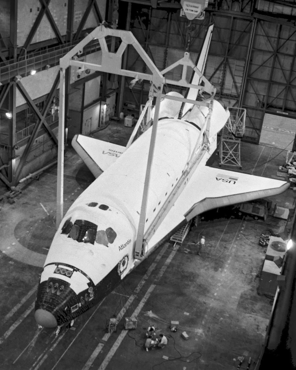 CAPE CANAVERAL, Fla. -- At the Kennedy Space Center in Florida, the space shuttle Atlantis is gently lowered into place next to the external fuel tank and solid rocket boosters in the Vehicle Assembly Building in preparation for its maiden flight, STS-51J. Photo credit: NASA