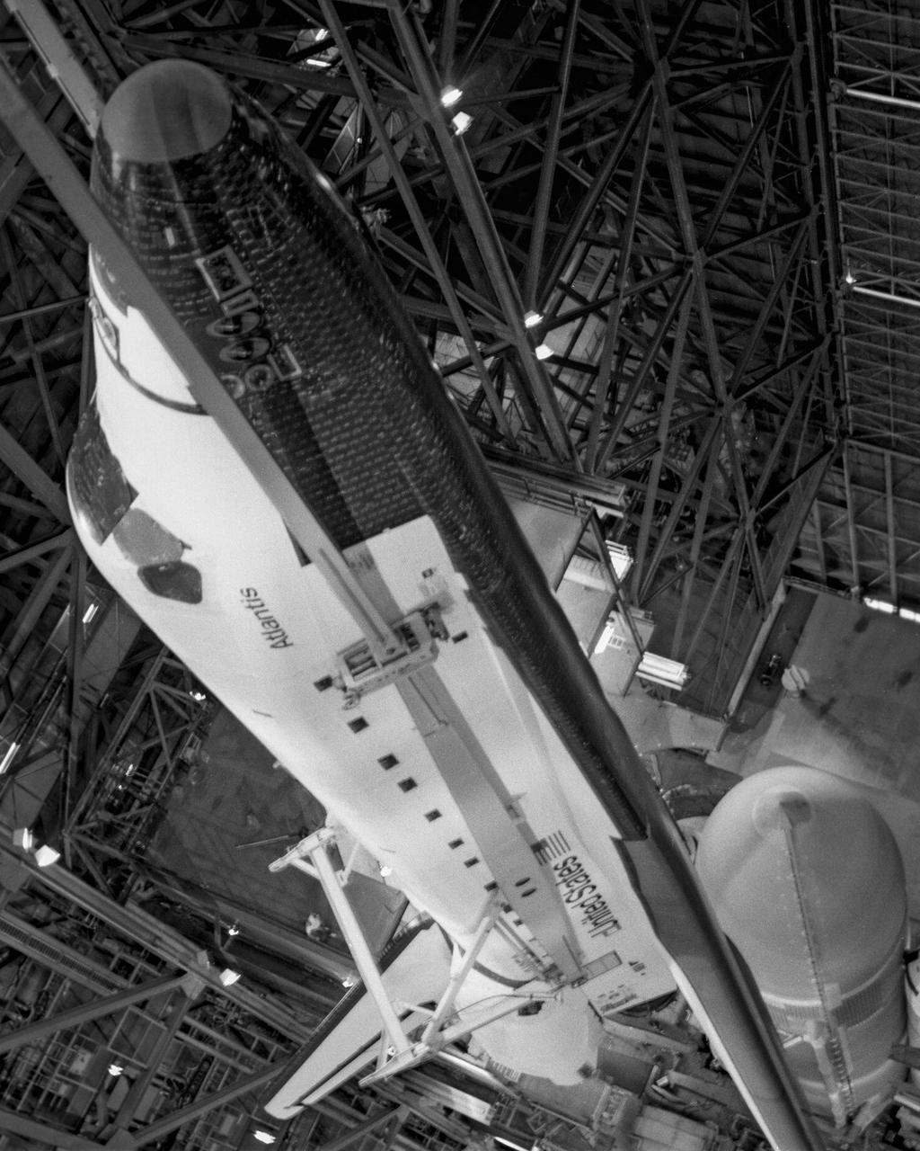 CAPE CANAVERAL, Fla. -- At the Kennedy Space Center in Florida, the space shuttle Atlantis is gently lowered into place next to the external fuel tank and solid rocket boosters in the Vehicle Assembly Building in preparation for its maiden flight, STS-51J. Photo credit: NASA