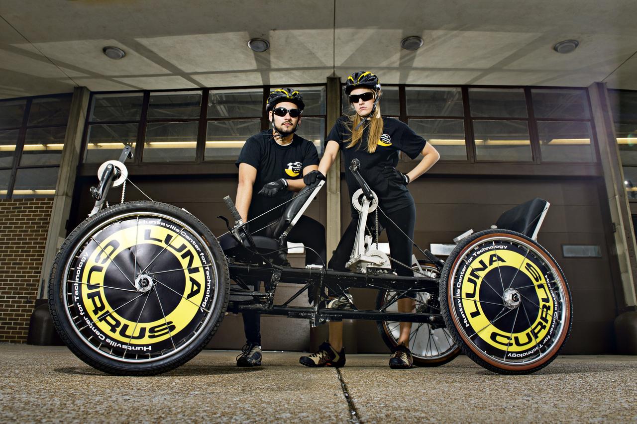 HUNTSVILLE CENTER FOR TECHNOLOGY STUDENTS AND MOONBUGGY CREW EZRA LOGREIRA AND KARINE WITTENBORG POSE WITH THEIR MOONBUGGY