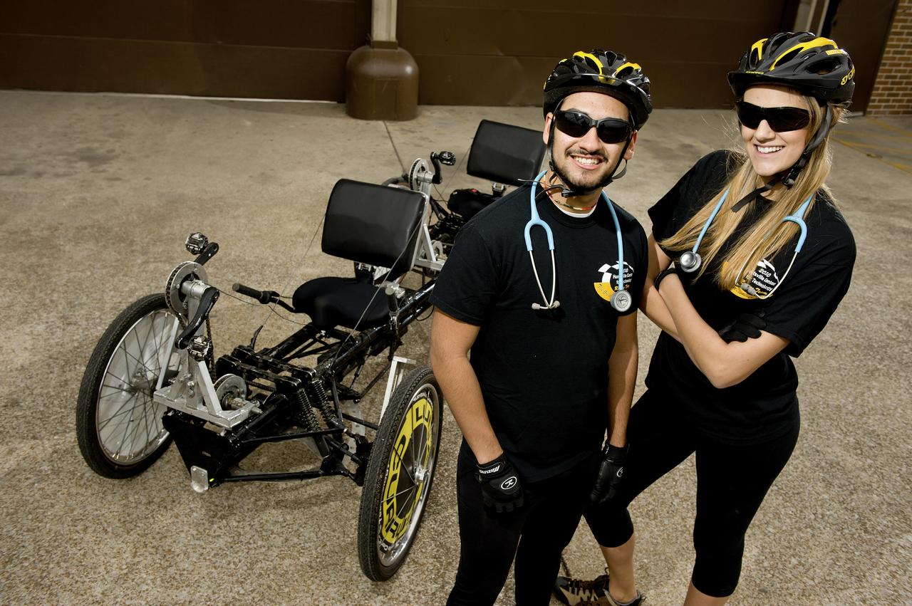 HUNTSVILLE CENTER FOR TECHNOLOGY STUDENTS AND MOONBUGGY CREW EZRA LOGREIRA AND KARINE WITTENBORG POSE WITH THEIR MOONBUGGY