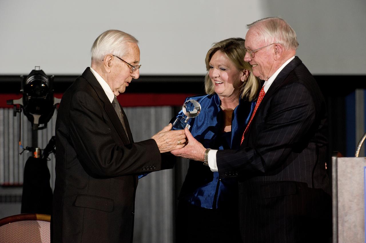 ASTRONAUT NEIL ARMSTRONG AND USSRC CEO DR. DEBRA BARNART PRESENT AN AWARD TO DR. GEORG VON TIESENHAUSEN AT AN EVENT IN HIS HONOR IN THE DAVIDSON CENTER.  