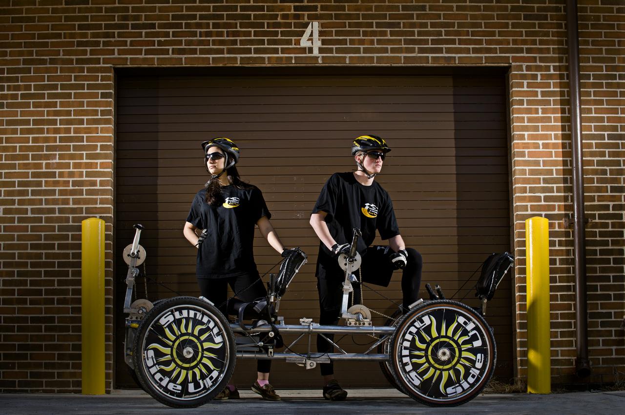HUNTSVILLE CENTER FOR TECHNOLOGY’S ROXY BAHANI AND HUNTER FLECKNER POSE WITH THE MOONBUGGY THEY WILL DRIVE IN THE 2011 GREAT MOONBUGGY RACE AT THE US SPACE AND ROCKET CENTER