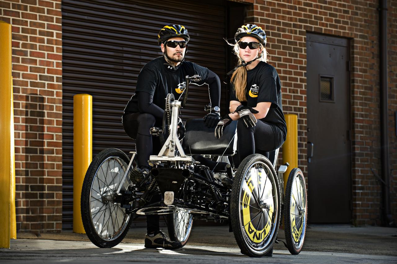 HUNTSVILLE CENTER FOR TECHNOLOGY’S EZRA LOGREIRA AND HEATHER BUNDY POSE WITH THE MOONBUGGY THEY WILL DRIVE IN THE 2011 GREAT MOONBUGGY RACE AT THE US SPACE AND ROCKET CENTER.  